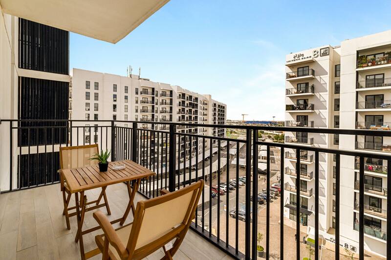 Private balcony with a bistro table and two chairs