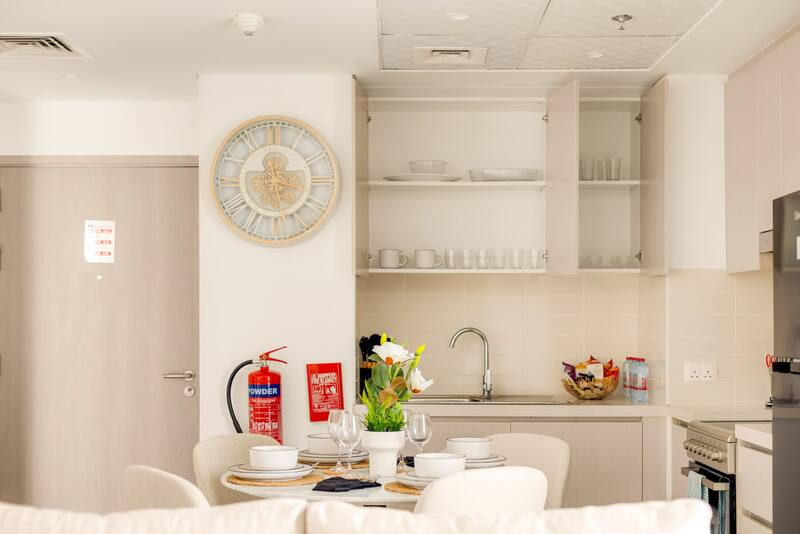 Kitchen with oven, hob, fridge and Nespresso machine