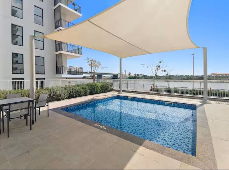 Community swimming pool with shade sail